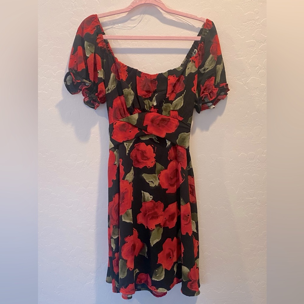Chic Black Dress with Red and Green Floral Design